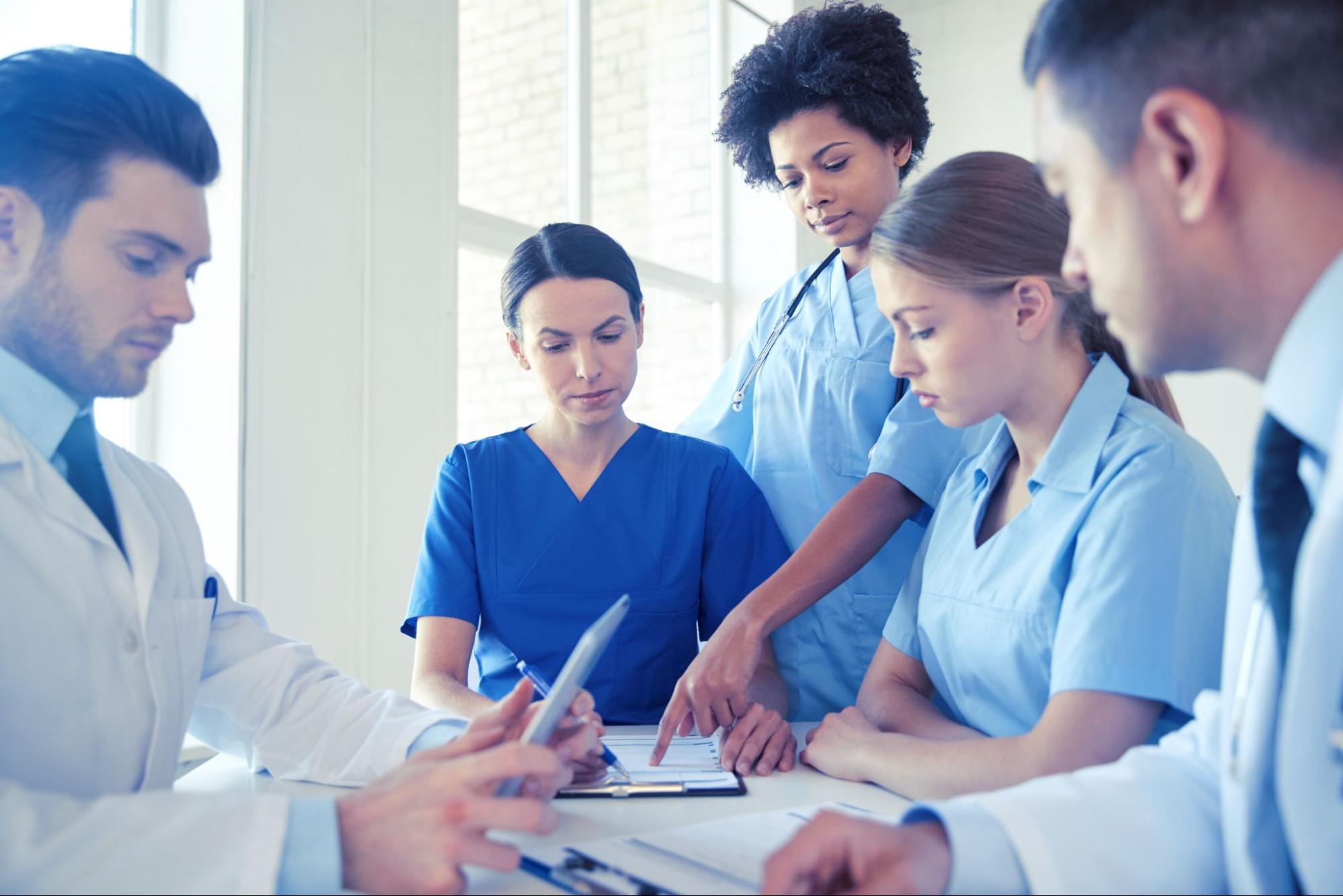 Group of professionals discussing together.