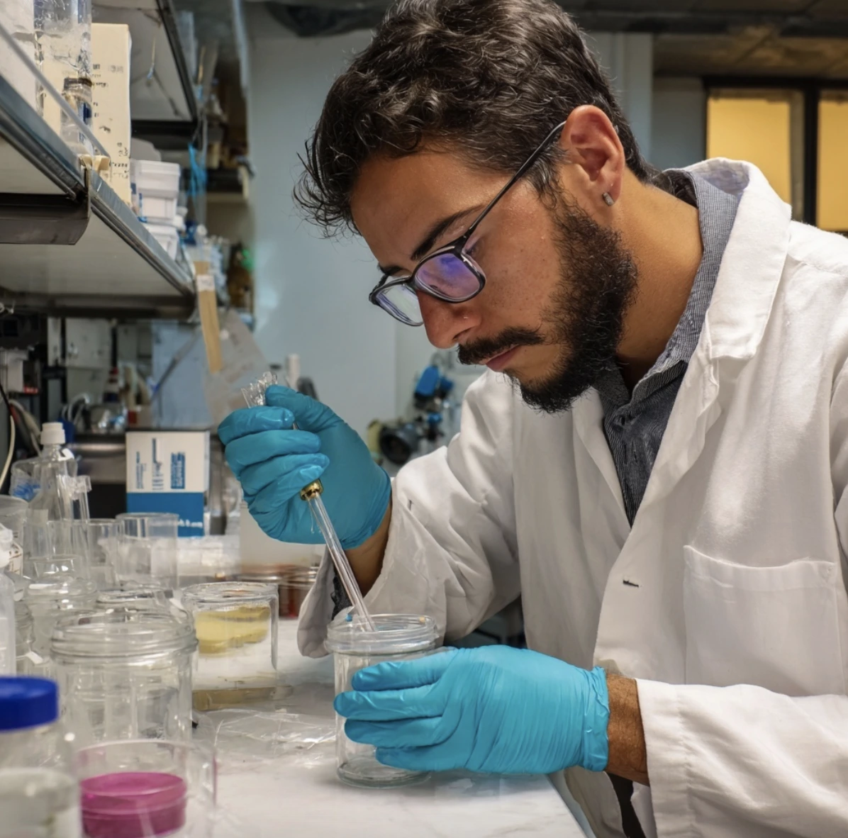 A mexican male researcher separating supernatant from pellet after centrifugation